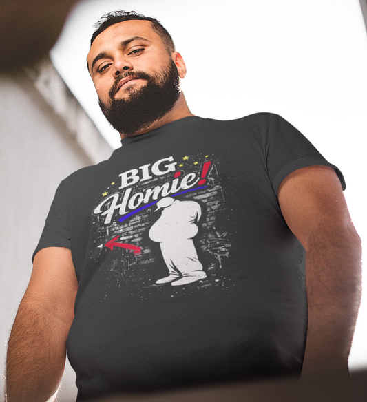 Man wearing a black t-shirt with colorful graphics and text.