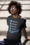 Man sitting on steps wearing a dark t-shirt with motivational text design.
