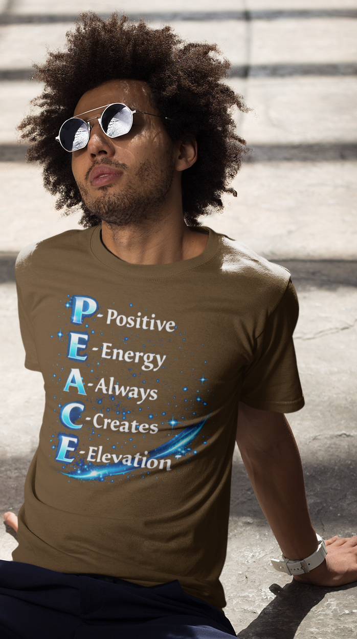 Man sitting on steps wearing a brown t-shirt with motivational text