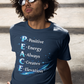 Man sitting on steps wearing a navy blue t-shirt with motivational quote