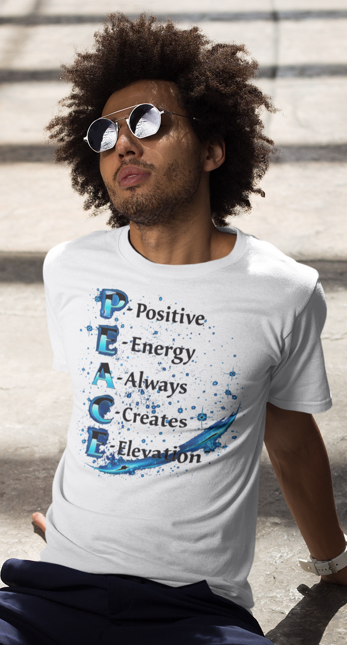 Person sitting on steps wearing a white t-shirt with text design.